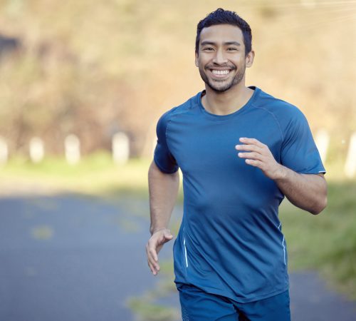 I run for and with my heart. Shot of a handsome young man running alone outside during the day