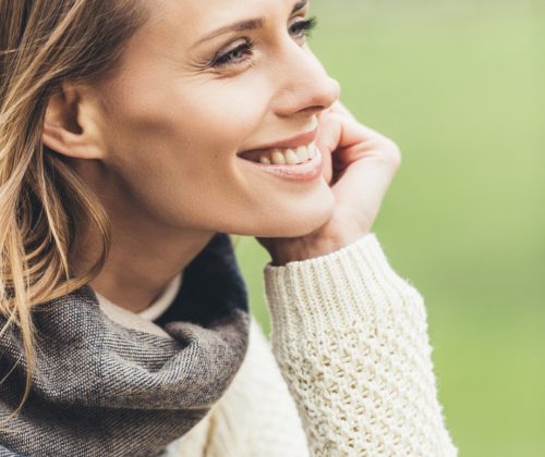 portrait of attractive smiling stylish woman